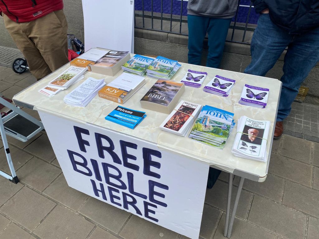 A street stall displaying Bibles and Christian tracts